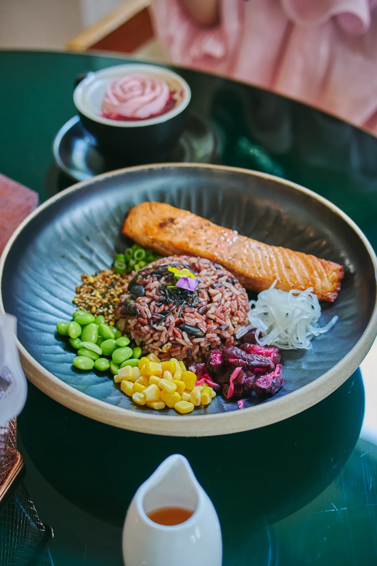 Grilled salmon rice bowl with edamame, corn and purple rice