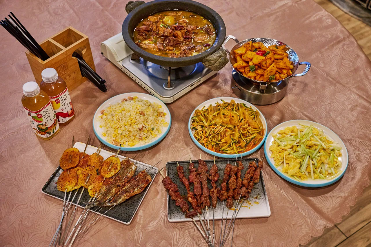 Table spread of grilled skewers, stews and stir-fried dishes