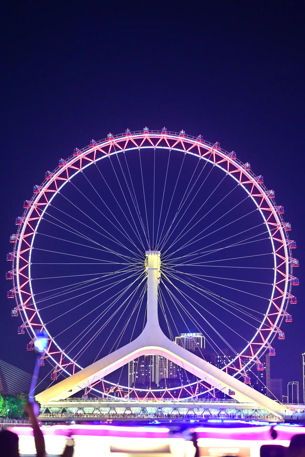 Singapore Flyer lit up in pink and blue at night