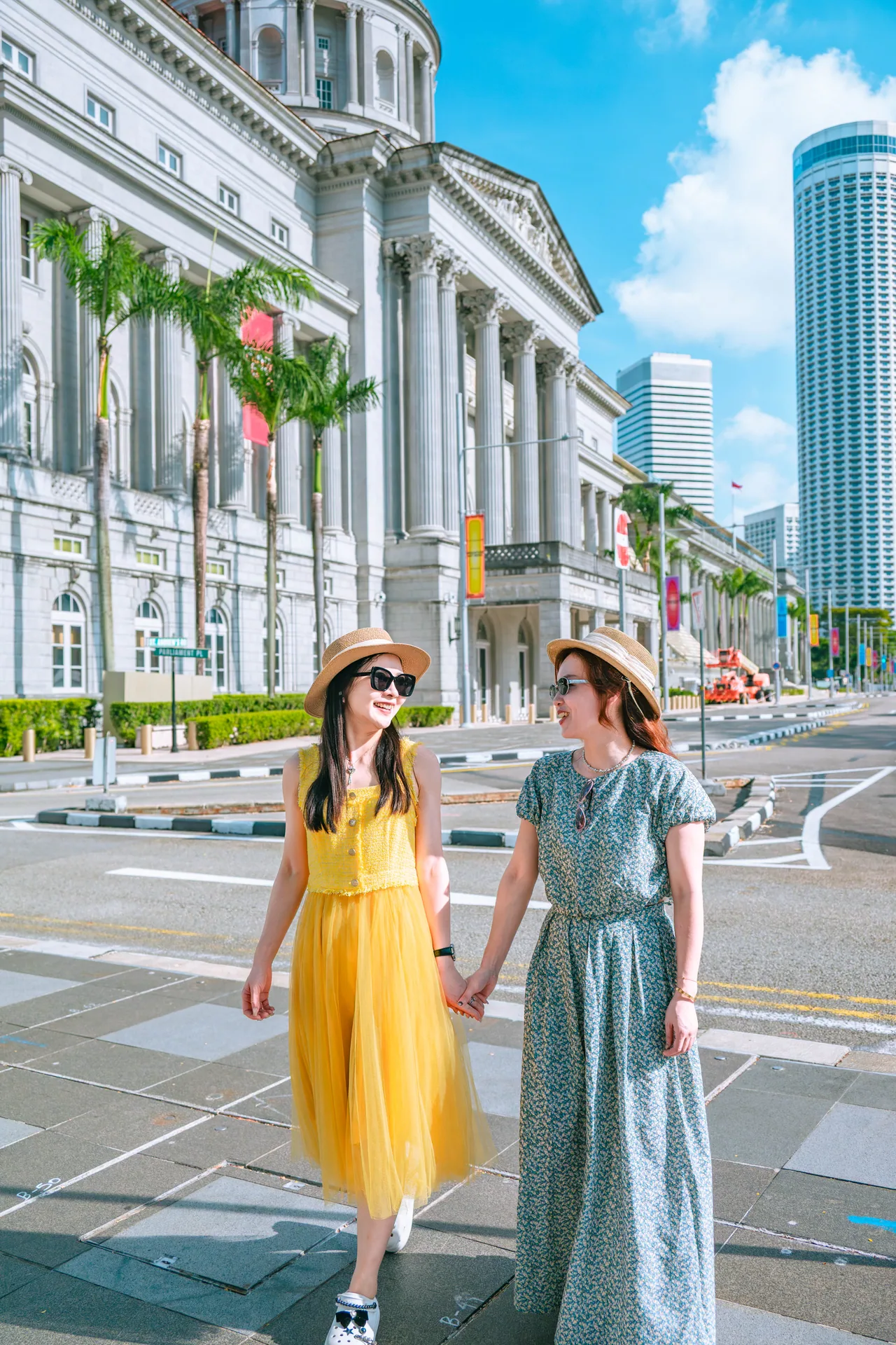 Two friends walking together through the Civic District